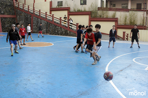 students-chasing-ball
